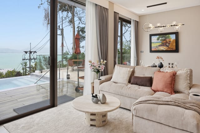 Great room wide view from kitchen toward the pool terrace and sea beyond