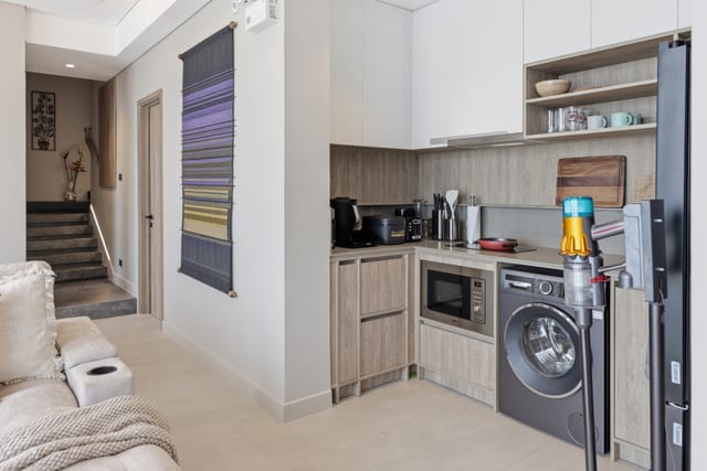 Open-plan kitchen and dining area with sea-facing terrace doors