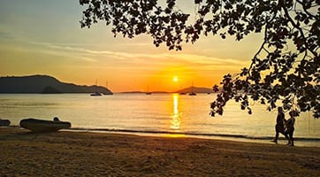 The five-star Veranda Resort Phuket beach pool with loungers at Ao Yon