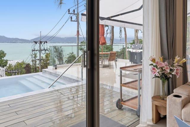 Daytime view from the terrace — uninterrupted Andaman Sea with outlying islands on the horizon